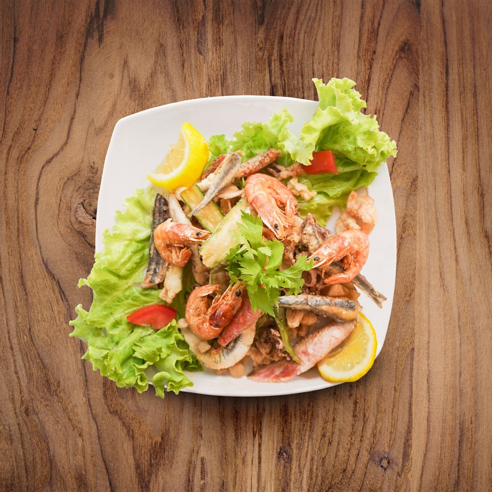 Catalana dish of fish with vegetables and fruits at Belforte restaurant